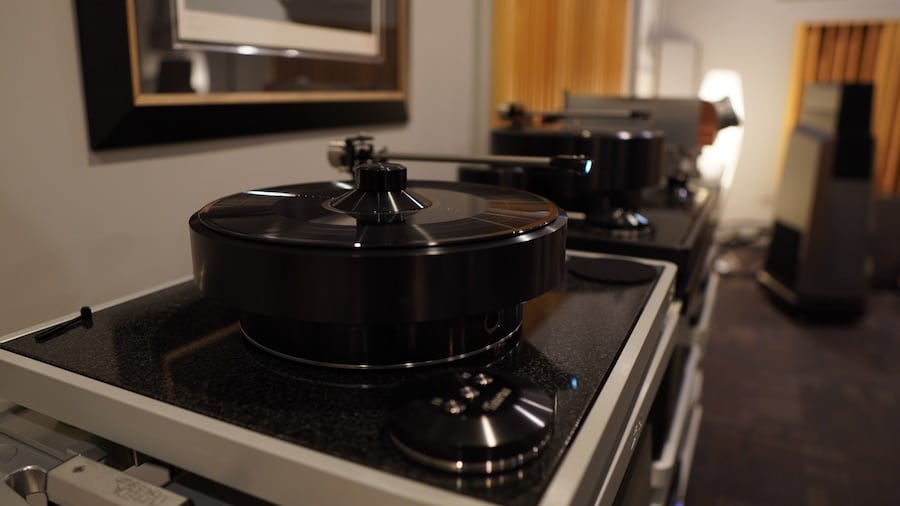 A high-end turntable playing performance-quality audio.