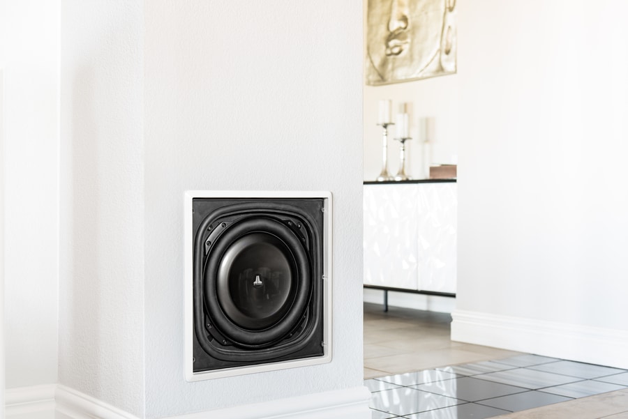 A home audio subwoofer on the floor.