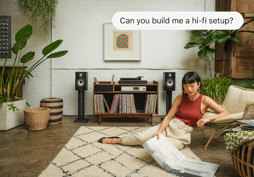 A woman next to a Bowers & Wilkins hi-fi speaker. Above the woman is a ChatGPT chat bubble that reads, ‘Can you build me a hi-fi setup?’