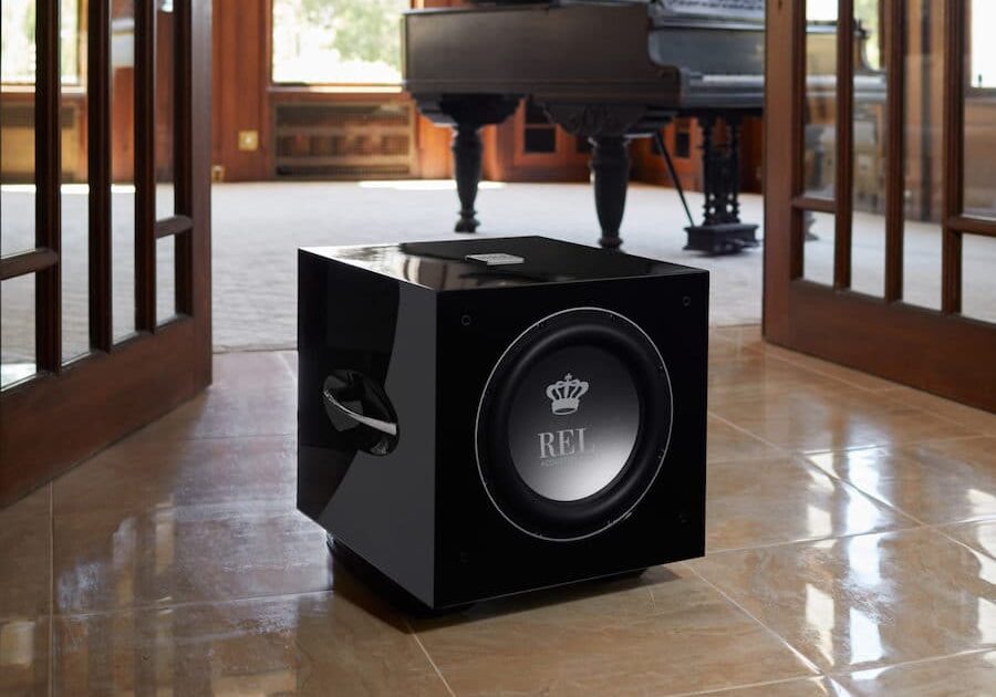 Close-up shot of a high-end subwoofer on the floor of an Atlanta home.